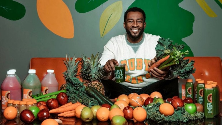 Christopher Goode, founder of Ruby Jean’s Juicery, 3000 Troost Ave. , with an array of fruits, vegetables and juices.