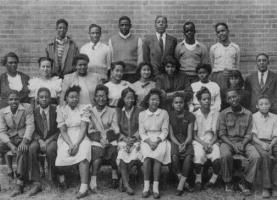Photo of Clarence Edward Gantt with school children.