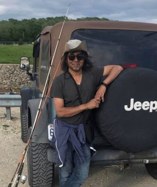 Asif Iqbal Khan next to his Jeep Wrangler during one a fishing trip last summer.