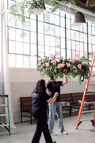 Lisa Molitor with a floral arrangement.