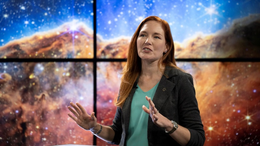 NASA James Webb Space Telescope Deputy Project Scientist for Communications Amber Straughn speaks about the infrared image of the star-forming region called NGC 3324 in the Carina Nebula as it is shown on a screen during a broadcast releasing the telescope's first full-color images from the Webb Telescope, Tuesday, July 12, 2022, at NASA's Goddard Space Flight Center in Greenbelt, Maryland.