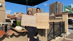 McKenzie Mays and Addy Wright protest outside of their former employer, Starbucks.