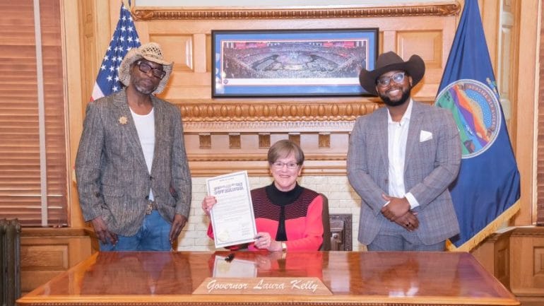 Marvin Brantley (left), Kansas Gov. Laura Kelly and Trae Q. L. Venerable at the declaration of Honoring Black Cowboy Day in Kansas.