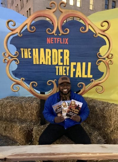 Trae Venerable with his children's books at the pop-up event for the Netflix film "The Harder They Fall."