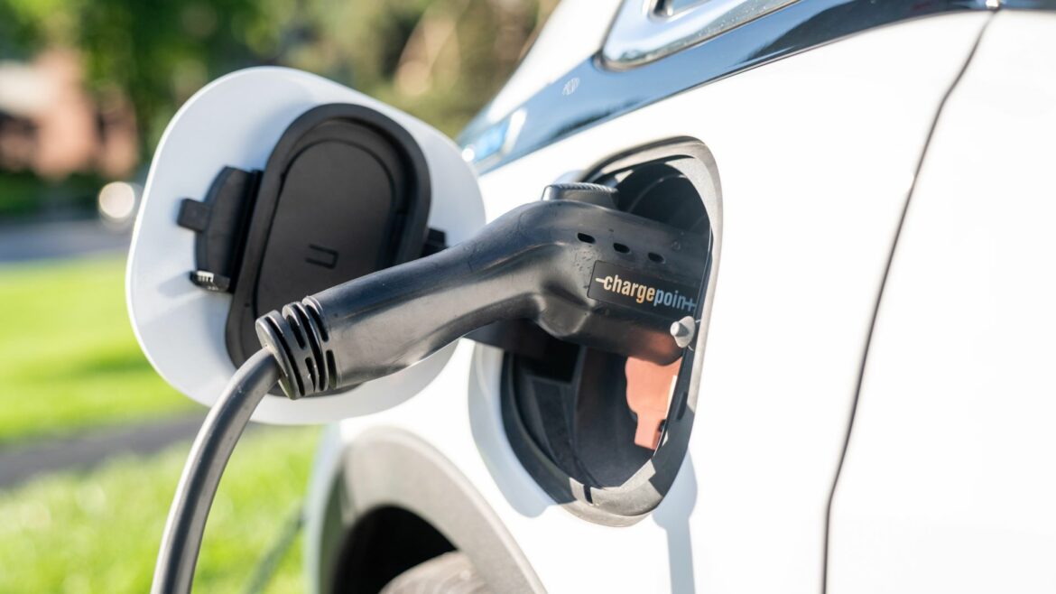 An electric vehicle as it is being charged.