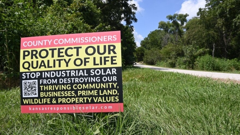 Signs protesting the proposed solar farm dot the countryside in Johnson county. This one is along N. 400th Road near Edgerton.
