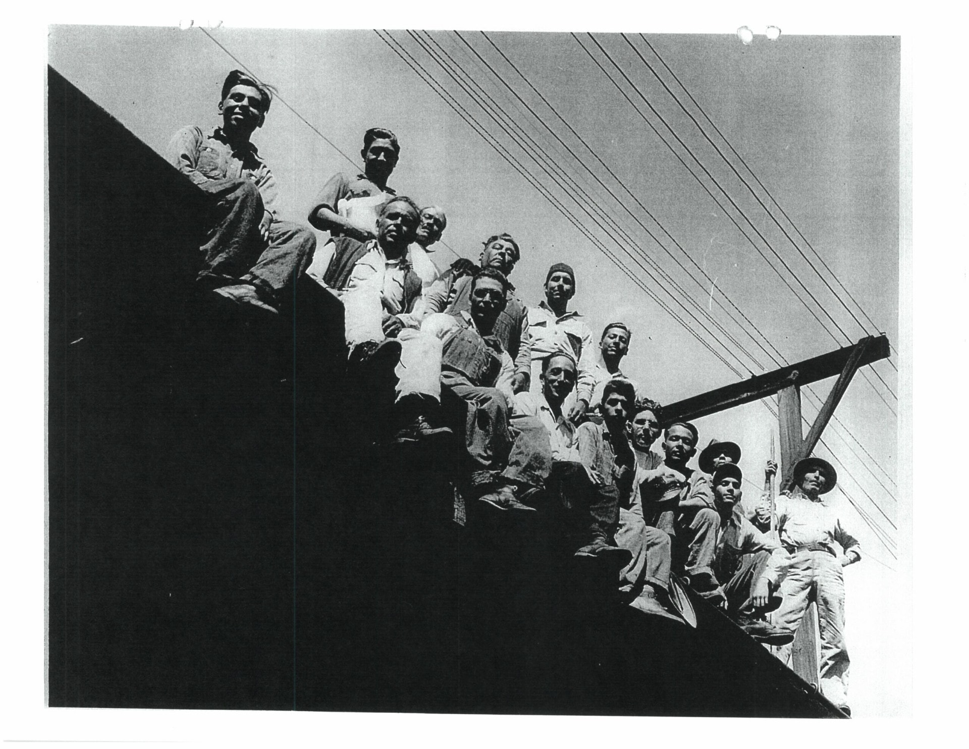 Railway workers sit atop the railroad. (Courtesy: Quiroga Family)