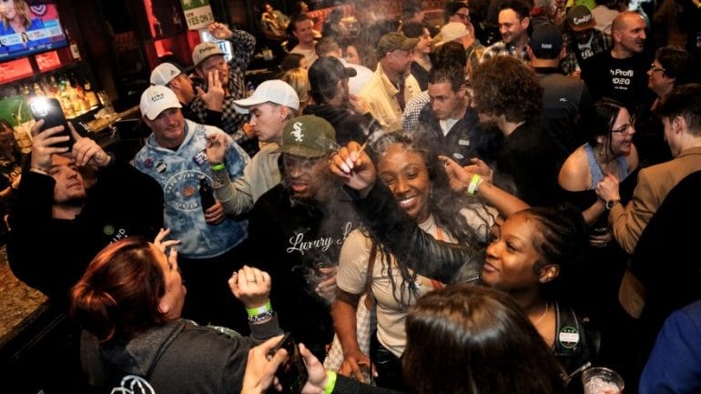 Supporters celebrate the passage of Amendment 3 on Tuesday during a watch party at the Crown Room in downtown St. Louis.