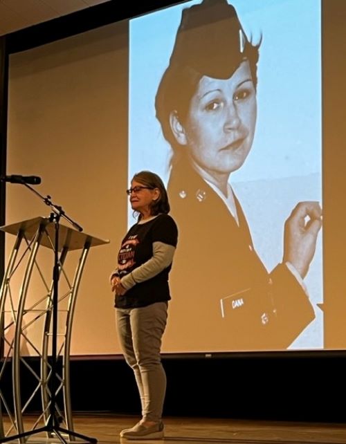 Katherine Iwatiw Menges, during the recent “Veteran Reader’s Theater,” read her story that described how a German hotel clerk in 1984 didn’t believe she was an Army combat medic. (Brian Burnes | Flatland)