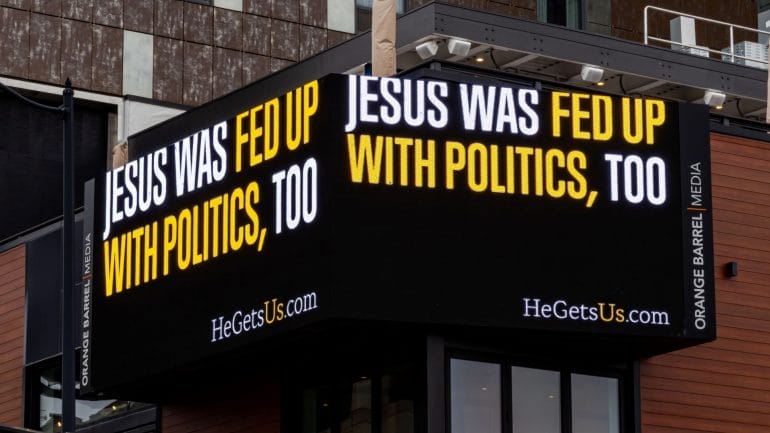 "He Gets Us" signage.