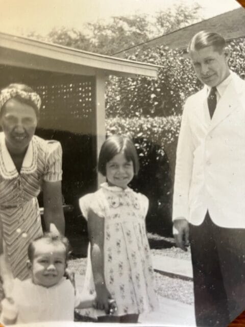Dorinda Makanaonalani Nicholson and her younger brother Ishmael with her parents Pansy and Buddy, outside their home on the Pearl City peninsula.