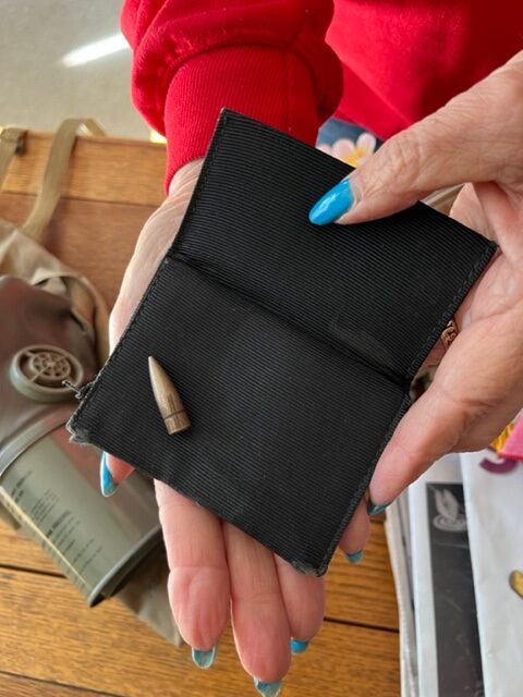 Nicholson still keeps a small collection of shrapnel collected in her childhood neighborhood in 1941 as well as this bullet her father recovered from a kitchen wall in their home.