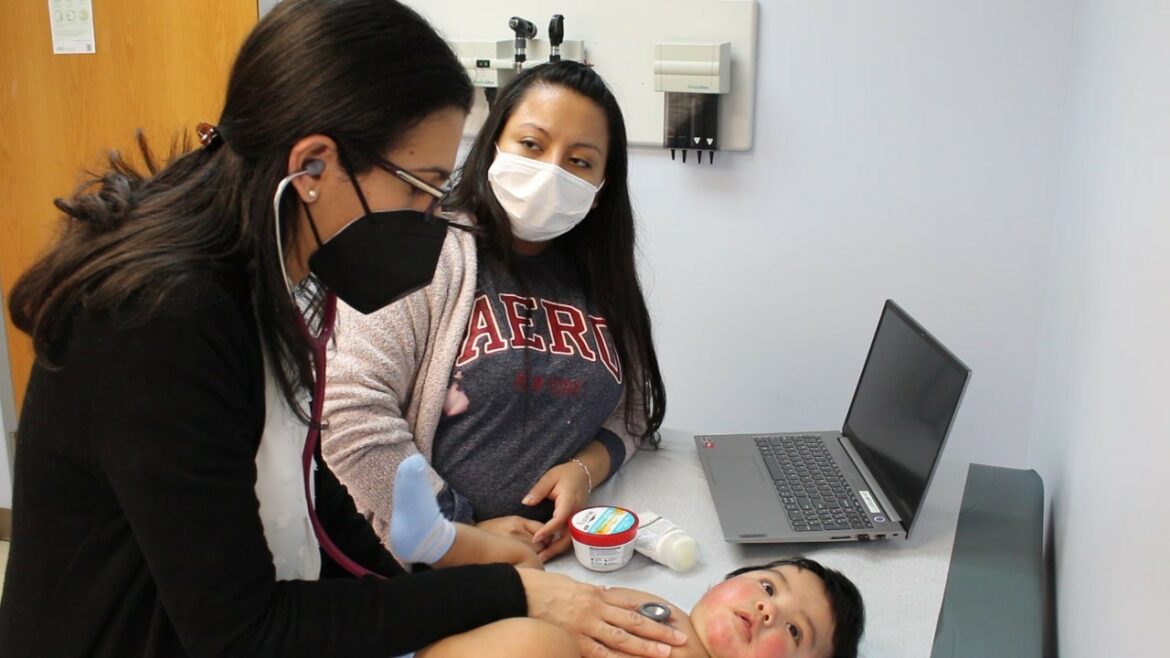 Dr. Paola Luna, a Vibrant Health pediatrician who immigrated from Colombia, conducts a well-baby visit.