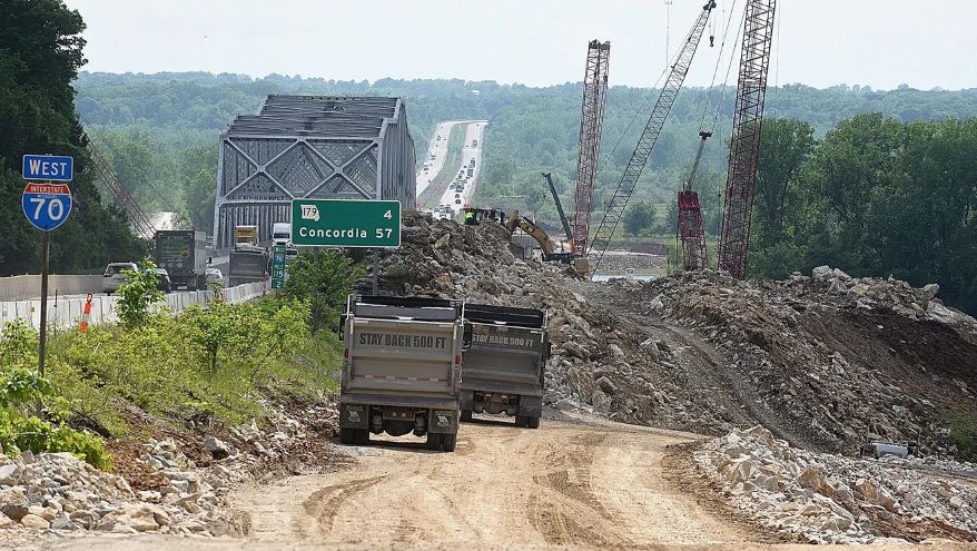 Construction workers haul limestone quarried from the river bluff to the construction site of a new Interstate 70 Missouri River bridge connecting Boone and Cooper counties.