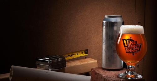 A Vine Street Brewing beer set in a construction setting.