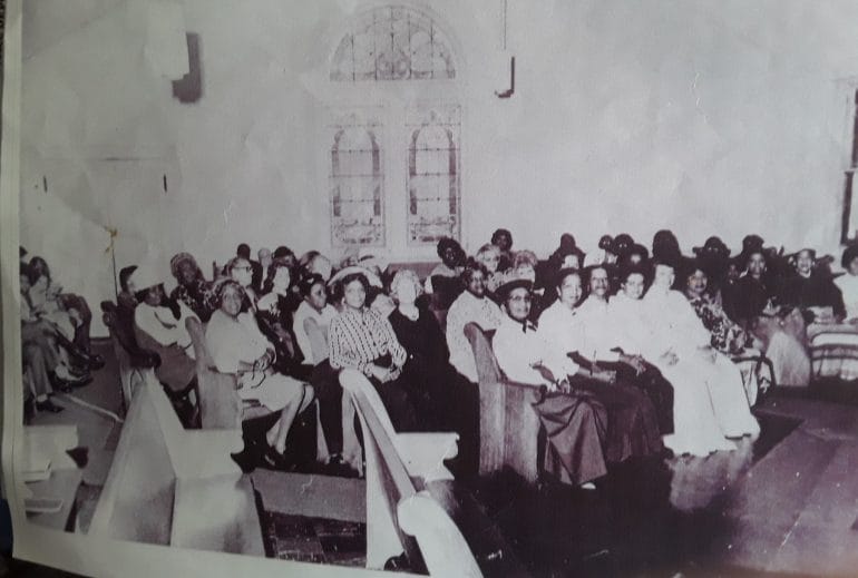 A black and white image showing congregants of Washington Chapel, a historic Black church in Parkville, Missouri.