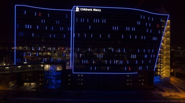 Opened in 2021, the Children’s Mercy Research Institute building glows at night with DNA sequences of Children’s Mercy patients.