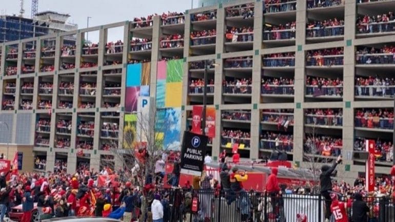 Fans pack a parking garage on Grand Boulevard to witness the Kansas City Chiefs Super Bowl championship parade.