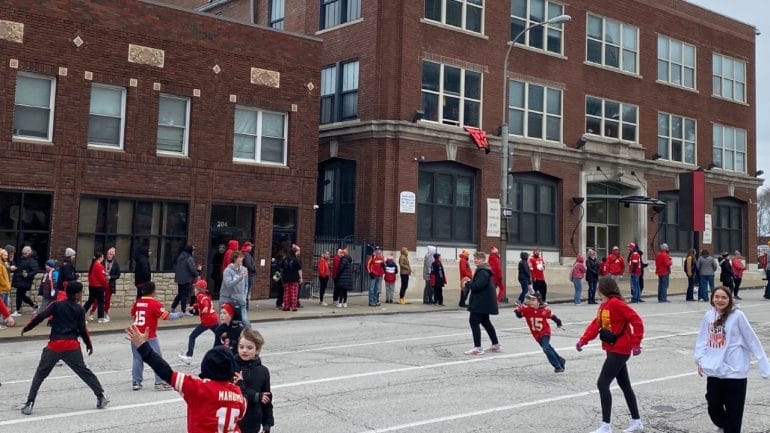 An impromptu touch football game took place on Admiral Boulevard before the Kansas City Chiefs Super Bowl championship parade.
