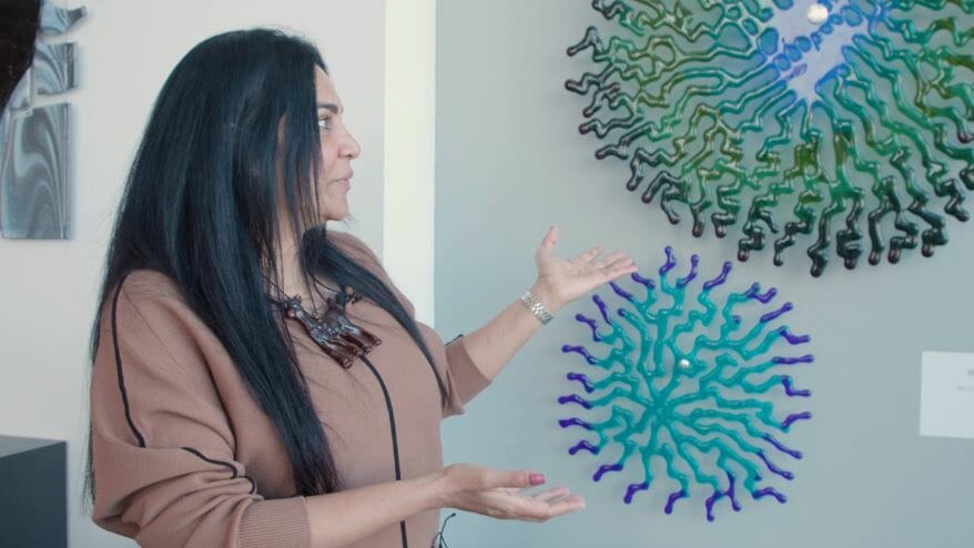 Hasna Sal, one of the artists featured at the new KCI terminal, showing some of her work.