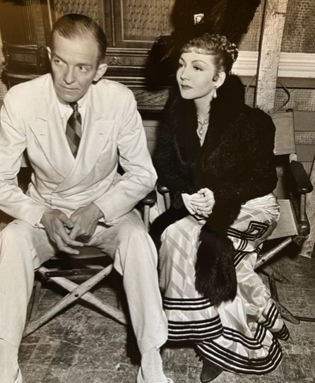 Landon Laird on a movie set with with Claudette Colbert in 1937.