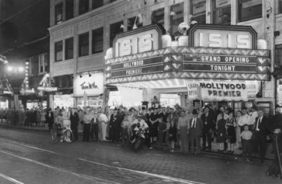 A crowd gathers outside of the Isis Theater at 31st Street and Troost Avenue in 1945.