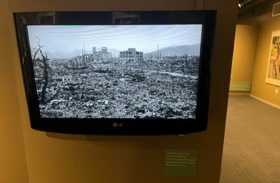 A monitor at the Truman Library installation continuously presents archival photos and film footage depicting the aftermath of the Hiroshima and Nagasaki bombings.