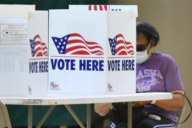 A Kansas City voter marks her ballot at Southeast Community Center in 2021.