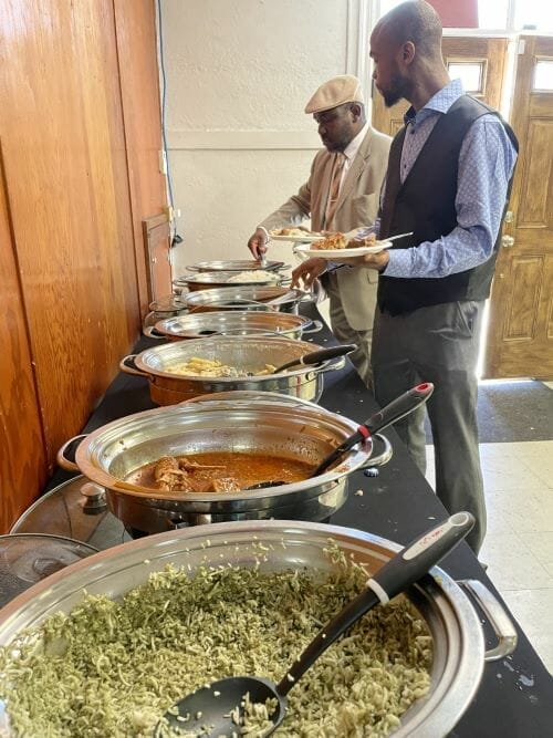 After a recent Sunday service, members of Revival of Hope Ministries enjoy a buffet with many traditional dishes.