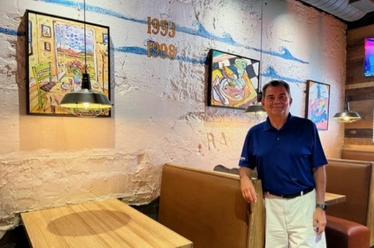 Margarita’s owner Dave Quirarte shows the high-water marks of Southwest Boulevard floods in 1993 and 1998.