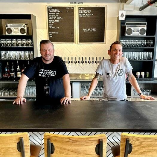 Nathan Ryerson and Brent Anderson behind the bar at Friction Beer Co.