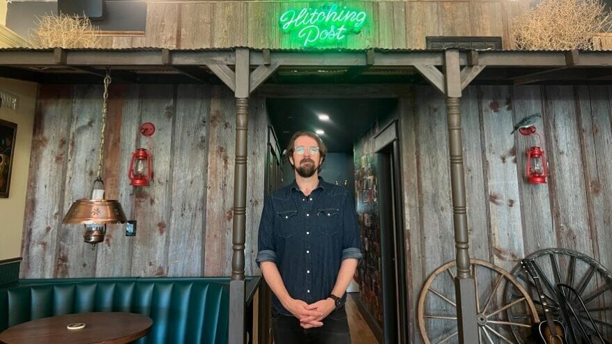 Paul Cloutier stands in front of the Hitching Post bar in Humboldt.
