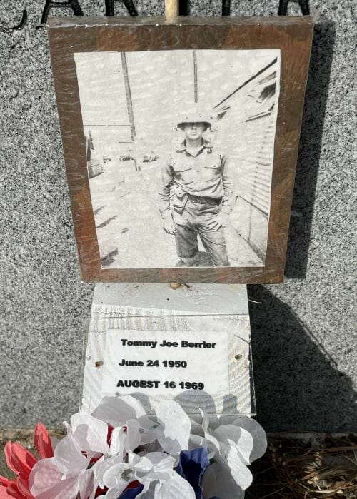 A personal memorial was left at the granite wall of the Vietnam Veterans Memorial Fountain in Kansas City.