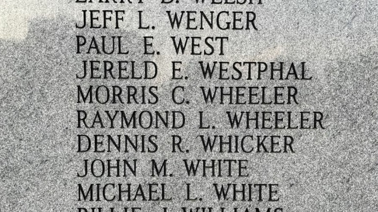 Names of veterans are etched into the granite wall at the Vietnam Veterans Memorial Fountain in Kansas City.