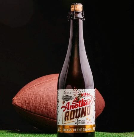 A bottle of Boulevard Brewing's Another Round with a football in the background.