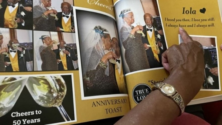 Iola Riley points to the words that her husband Ernest wrote and then read to her during their 50th wedding ceremony. His sentiments of love are included in an album commemorating the renewal of their vows. They've now been married 56 years and are aging in place.