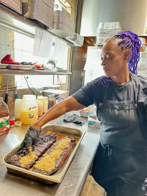Barbecue pitmaster Veronica Scroggins at work.