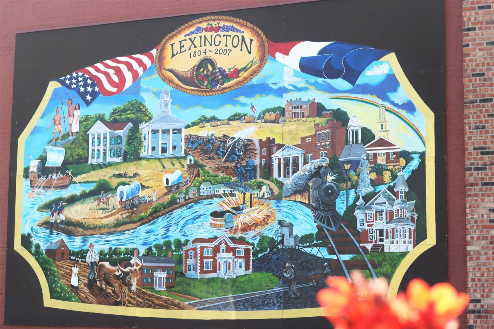 A brightly colored mural shows elements of Lexington's history.