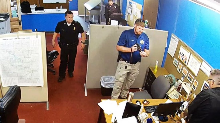 Marion Police Chief Gideon Cody, top left, spearheaded the Aug. 11 raid of the Marion County Record. During the raid, Cody reviewed a file on him that revealed a confidential source who had accused Cody of misconduct.