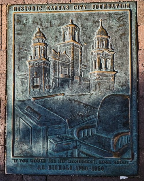 A plaque embedded in the sidewalk outside of the old entrance to the J.C. Nichols Co. declares: "If you would see his monument, look about."