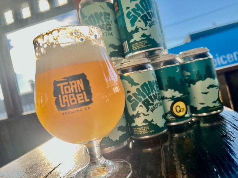 Torn Label Brewing Co.'s Smoke Ring in a glass and cans.
