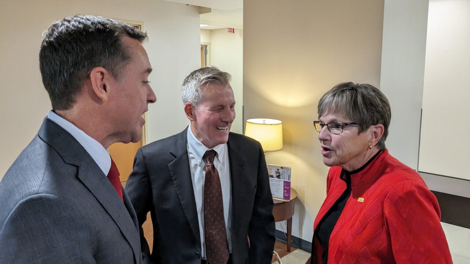 Blake Benson, board chairman of Ascension Via Christi Hospital in Pittsburg, left, and Dennis Franks, CEO of Neosho Memorial Regional Medical Center in Chanute, speak in October with Gov. Laura Kelly about expanding Medicaid coverage to nearly 150,000 more Kansans.