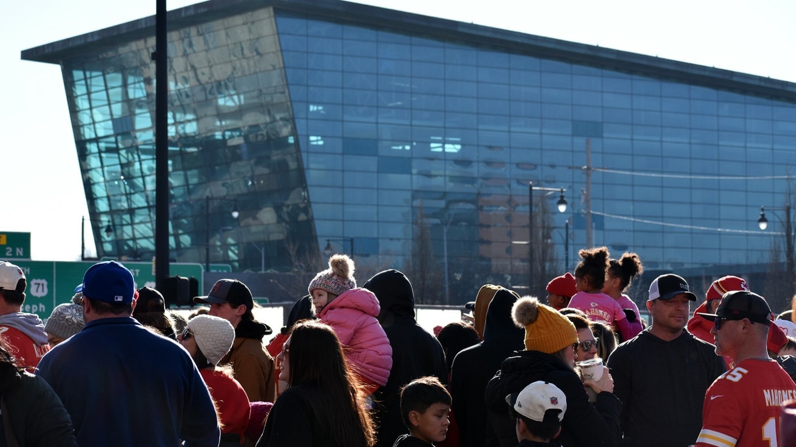 The former Kansas City Star building looms behind Chiefs victory parade-goers in the Power & Light District.