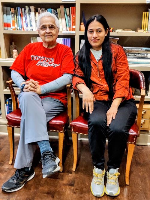 Panamanian native Chely Scarbrough, left, a board member of the Heartland Welcome and Support Coalition, often serves as an interpreter for Yeneily Angulo and her family, asylum seekers from Venezuela now living in Kansas City, Kansas.