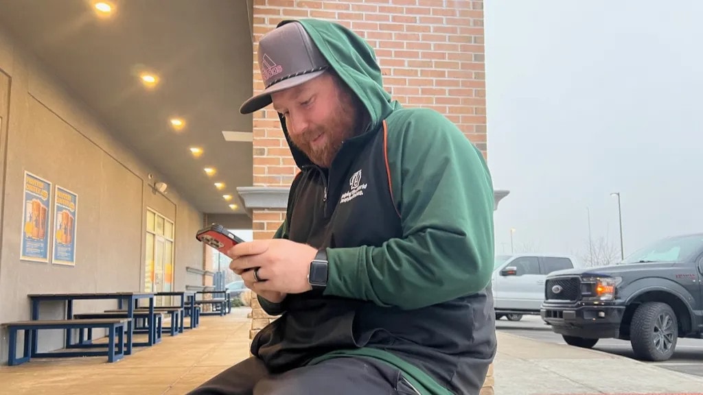 Andrew Gallamore sometimes makes sports bets on the DraftKings app on his phone.