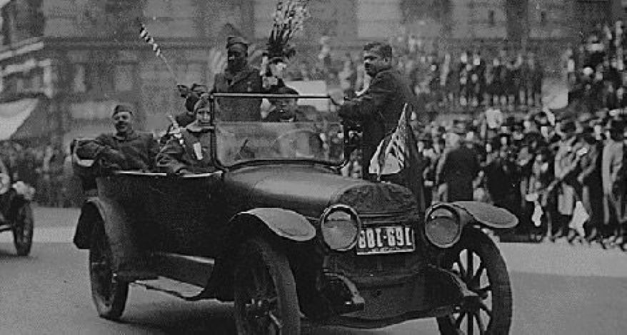 When the 369th Infantry marched up New York City’s Fifth Avenue after returning from France in February 1919, Henry Johnson rode in an open car carrying a bouquet of lilies.