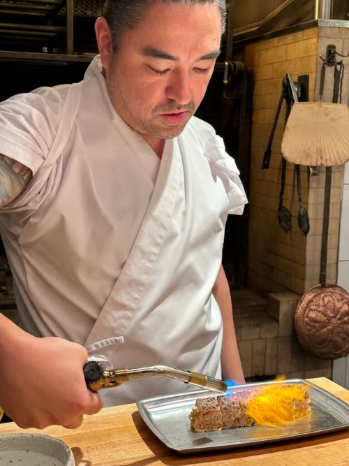 David Utterback uses a torch to add a light sear for flavor (and a bit of showmanship) to his sushi.