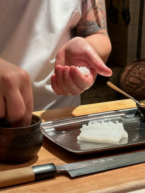 David Utterback shapes rice for nigiri by hand while he shares personal stories with his diners.