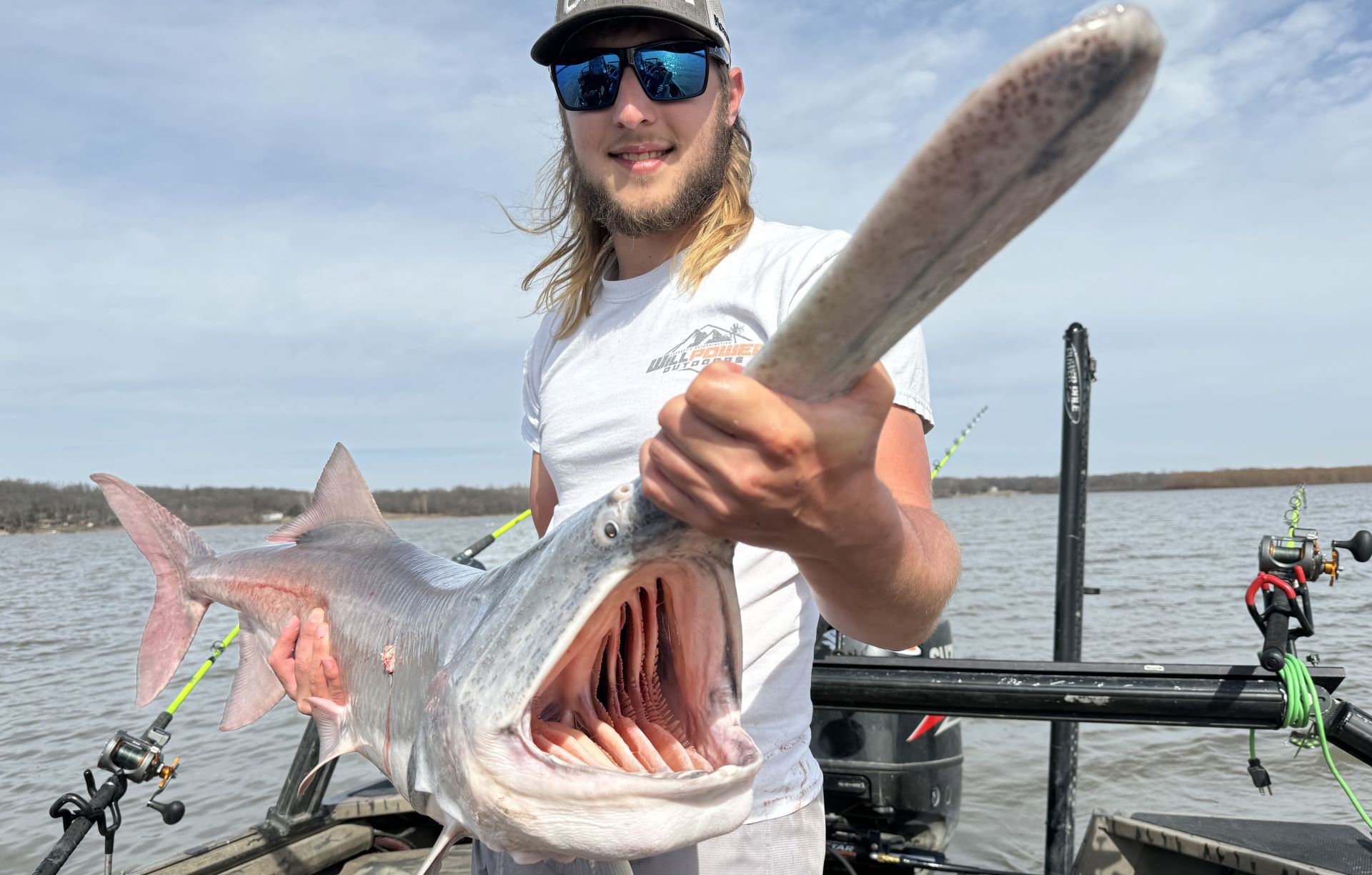 Haydn Williams, a guide on Grand Lake O' the Cherokees, displays the carrier of spring fever – a paddlefish.
