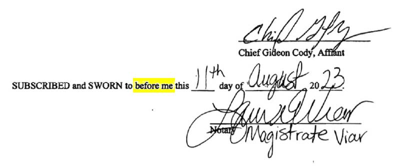 Signatures on a search warrant application.